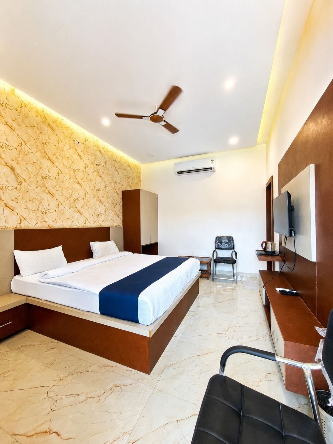 Bright deluxe room at The Ambay Villa Udaipur