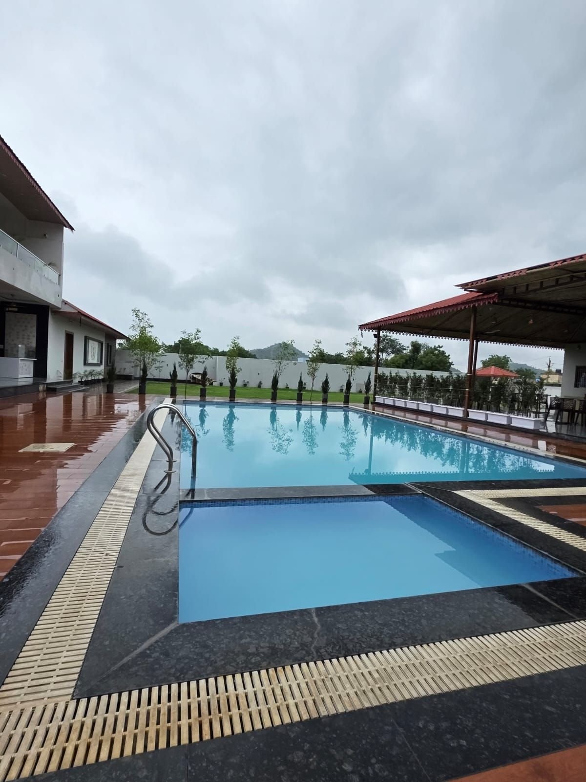 Kids' pool and deck at The Ambay Villa Udaipur